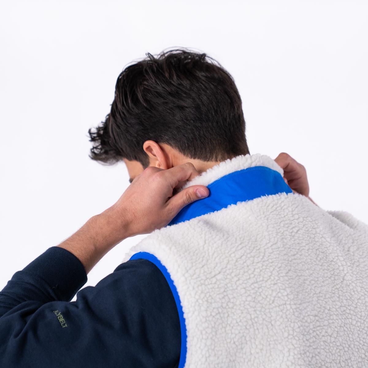 Mouwloze unisex sherpa jas met rits - Ivoor en blauw - Beige