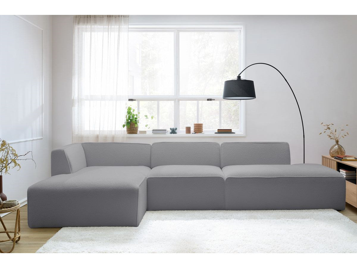 Modulaire vaste hoekbank MEGEVE bouclé stof met 1 chauffeuse en 1 poef