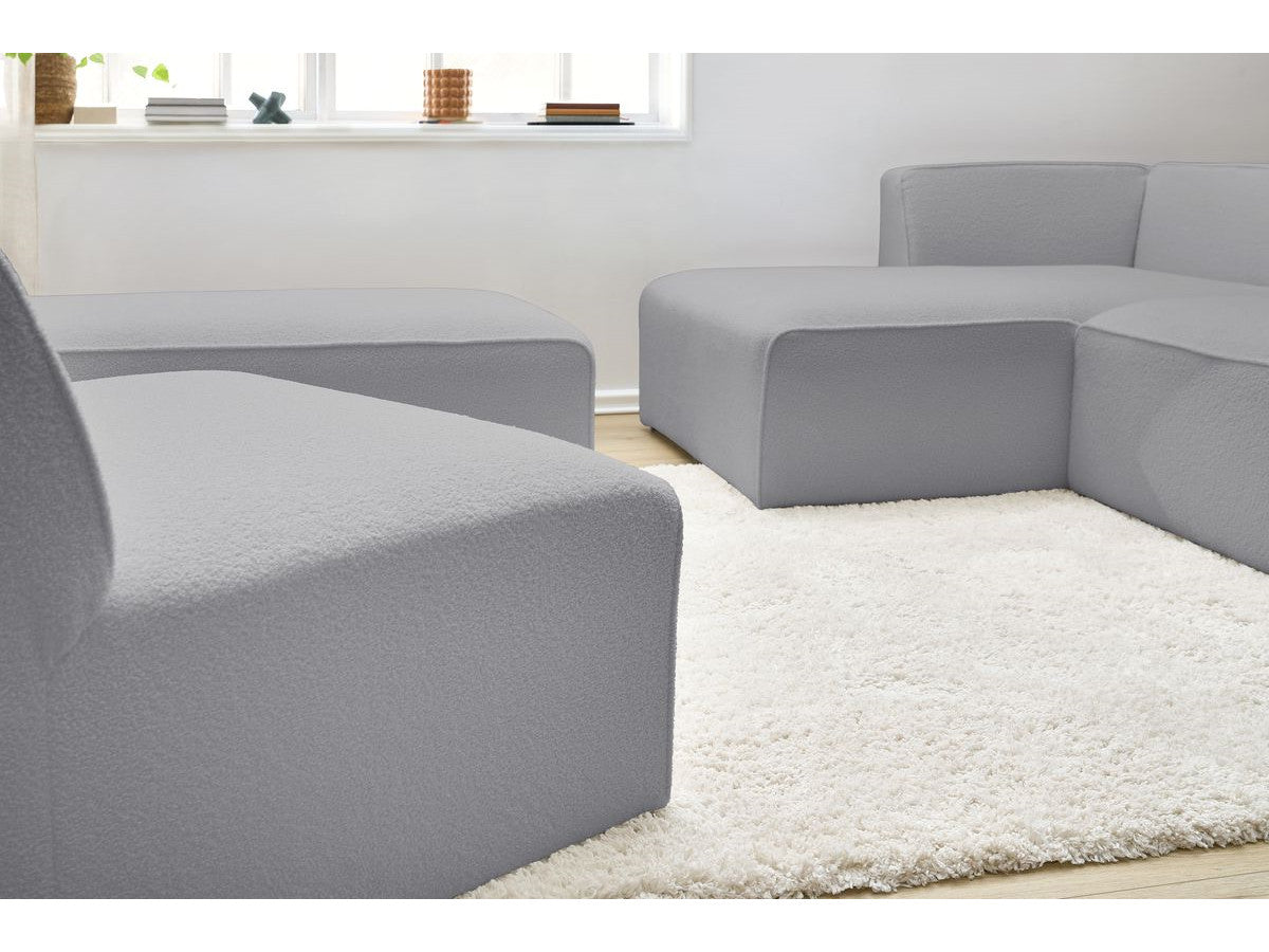 Modulaire vaste hoekbank MEGEVE bouclé stof met 1 chauffeuse en 1 poef